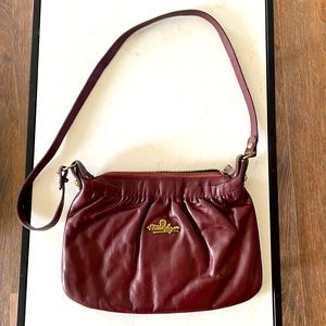 Vintage bag from the 70’s of Etienne Aigner. Burgundy color